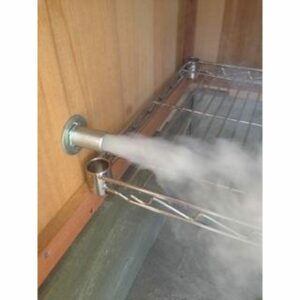 Smoke billowing into the smoking chamber through a cold smoke generator