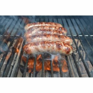 Brats sizzling on the grill, showcasing delicious grill marks and savory aromas