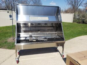 A 59-inch long stainless steel spit roaster, gleaming and ready for a rotisserie grilling adventure