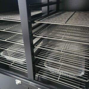 Stainless steel racks neatly arranged inside a cabinet smoker, ready for optimal grilling and smoking