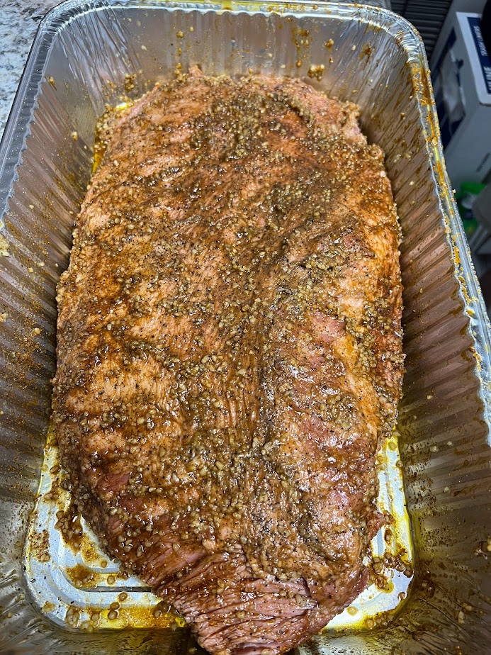 Raw Beef Brisket, seasoned with a hemp oil binder, Kinders Cherry Chipotle seasoning, and minced garlic. Ready for smoking.
